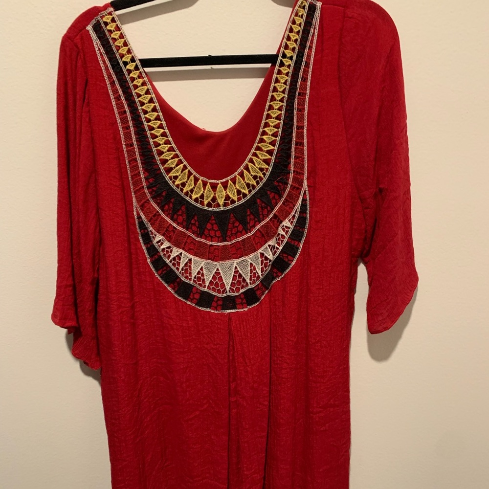 Red dress with exposed back tht has lace detailing